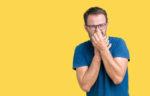 man holding nose