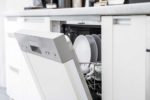 dishwasher with door slightly open revealing clean dishes
