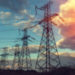 View of large power lines during a sunset