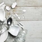 broken dishes on a wooden surface