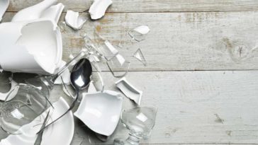 broken dishes on a wooden surface