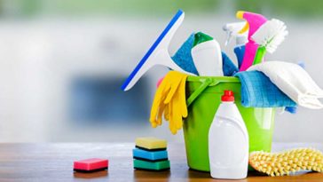 bucket of cleaning supplies on a counter top