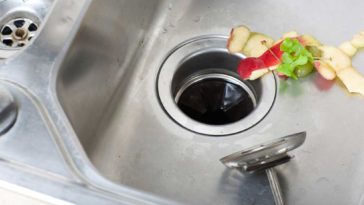peels being put down the dink drain into the garbage disposal