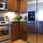 Stainless steel appliances in a kitchen with wood cabinets