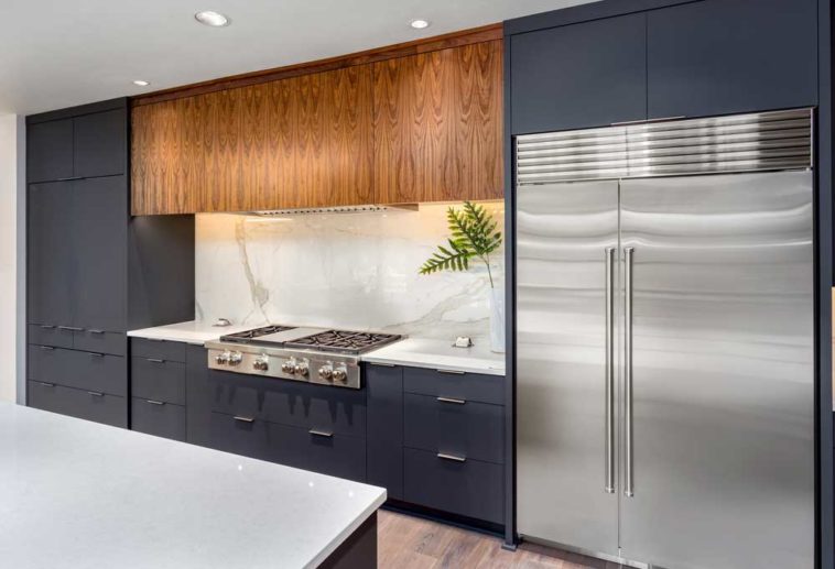 Stainless Steel Appliances in a dark grey themed kitchen