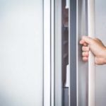hand opening fridge door