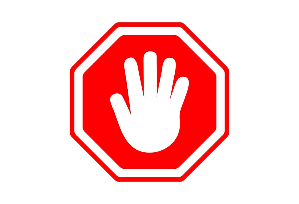 Stop sign symbol with silhouette of a hand instead of the word stop