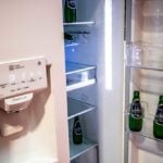 LG Refrigerator with door open and bottles in door