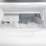 Icemaker inside freezer full of ice