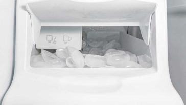 Icemaker inside freezer full of ice