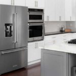 KitchenAid fridge with freezer on bottom in a white kitchen