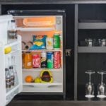mini fridge with open door showing contents