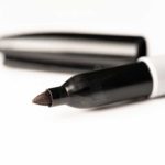 Open sharpie marker on a white background