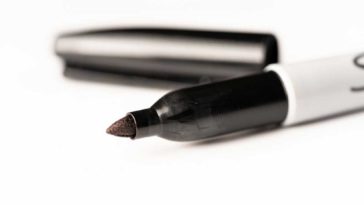 Open sharpie marker on a white background