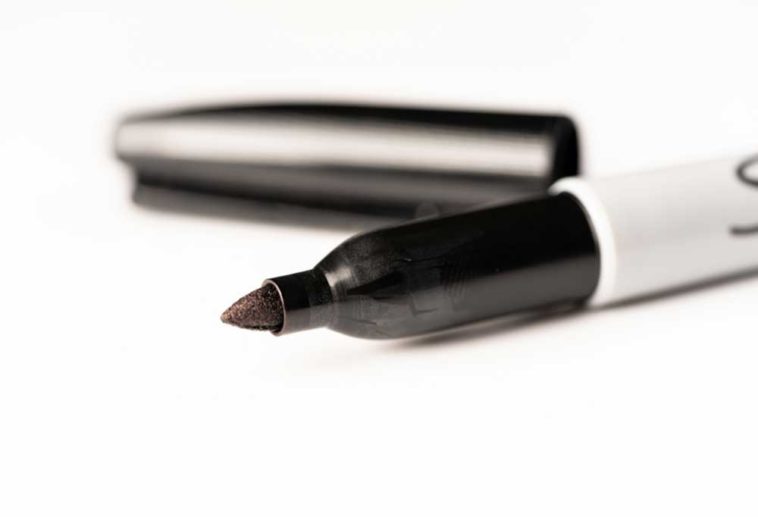 Open sharpie marker on a white background