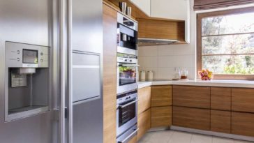 stainless steel side by side fridge in a modern kitchen
