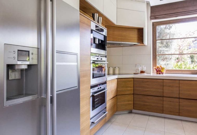 stainless steel side by side fridge in a modern kitchen