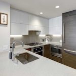 White kitchen with fridge covered in grey wood panel