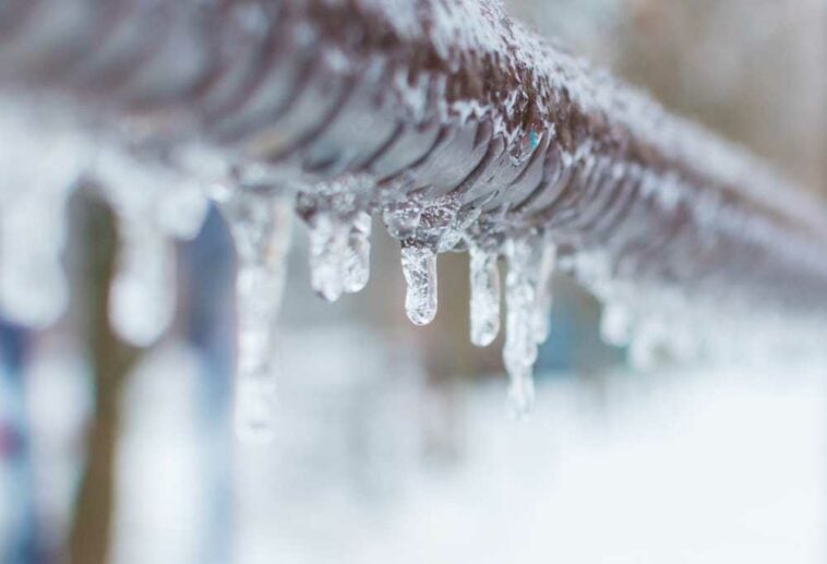 Copper tubing covered in ice