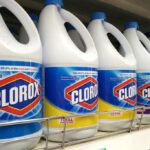Bottles of Clorox bleach lining a grocery store shelf