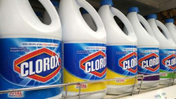 Bottles of Clorox bleach lining a grocery store shelf