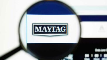 View of a magnifying glass with the logo for Maytag enlarged in the center