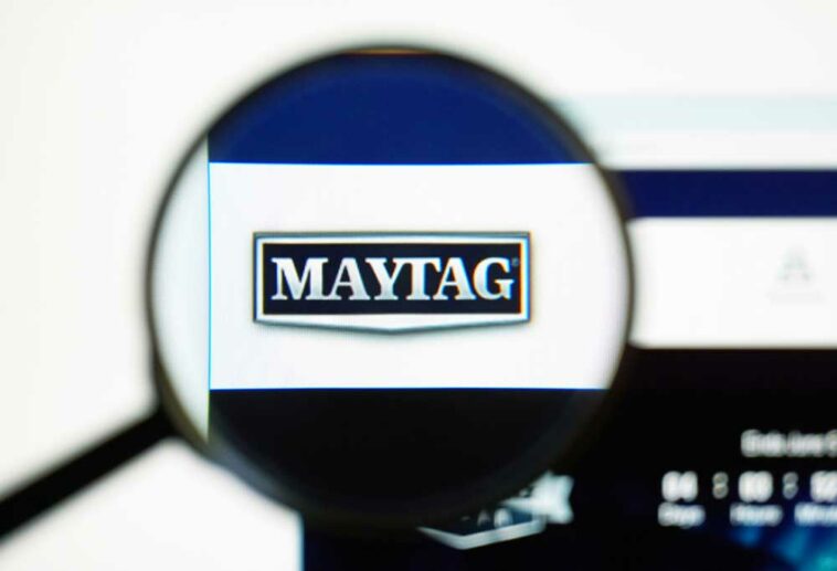 View of a magnifying glass with the logo for Maytag enlarged in the center