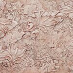 Grape leaf themed textured wall covered in a mauve colored paint