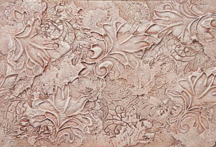 Grape leaf themed textured wall covered in a mauve colored paint