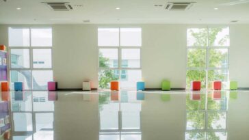 3 windows reflecting light onto a shiny white epoxy floor
