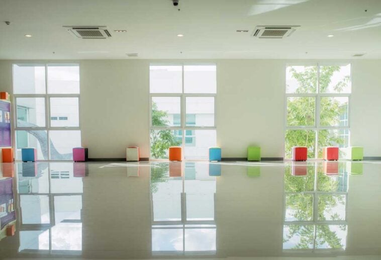 3 windows reflecting light onto a shiny white epoxy floor