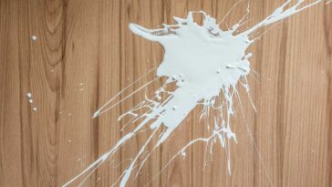 White paint spilled on hardwood dloors