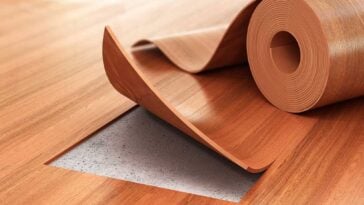 Linoleum made to look like wood with a section pulled up to show a cross section