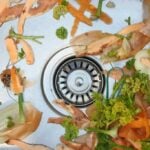 Random vegetable peels in a kitchen sink