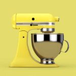 Yellow KitchenAid mixer on a yellow background