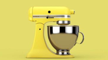 Yellow KitchenAid mixer on a yellow background