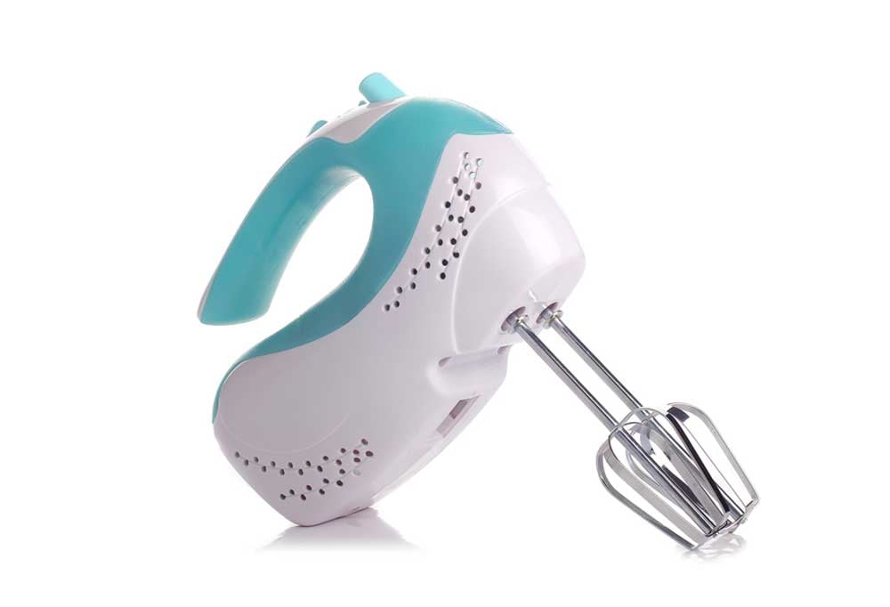 Teal and white hand mixer on a white background