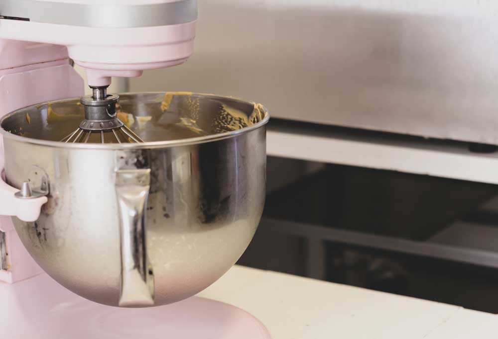 Close up of a pink KitchenAid stand mixer