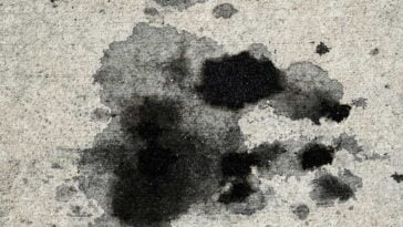 Oil and grease splattered on a concrete drive