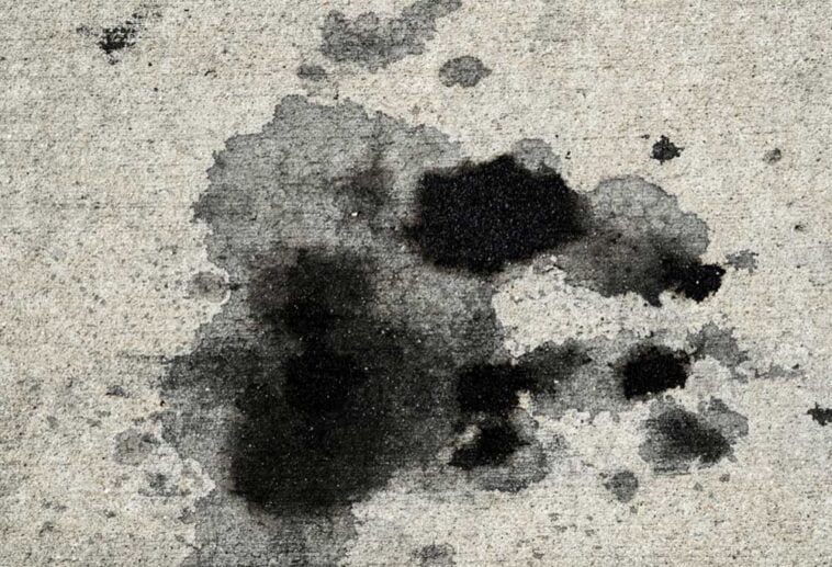Oil and grease splattered on a concrete drive