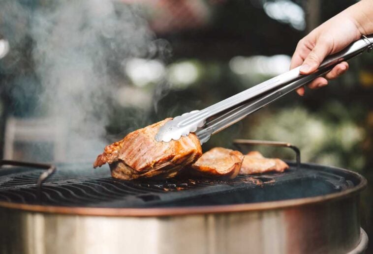 Chicken being cooked on a barbecue grill