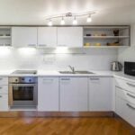 Clean white kitchen with laminate cabinets
