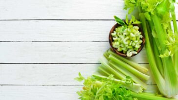 vairety of cuts of celery on a slatted wooden surface