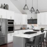 Kitchenaid refrigerator set in white cabinets in a modern kitchen