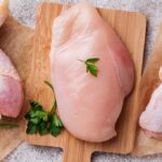 3 cuts of raw chicken on cutting boards
