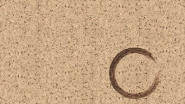 Background of Corian with a circle burn mark in the bottom right corner