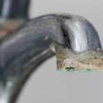 Faucet covered in hard water scales