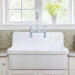 large, white kitchen sink in a farmhouse kitchen